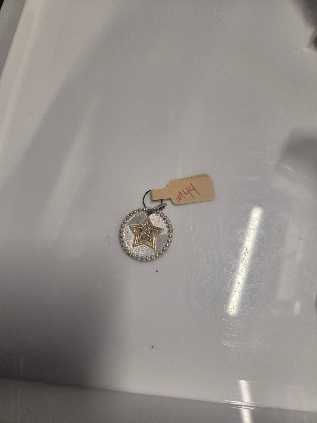 #44 STERLING STAR DISC W/ DIAMONDS